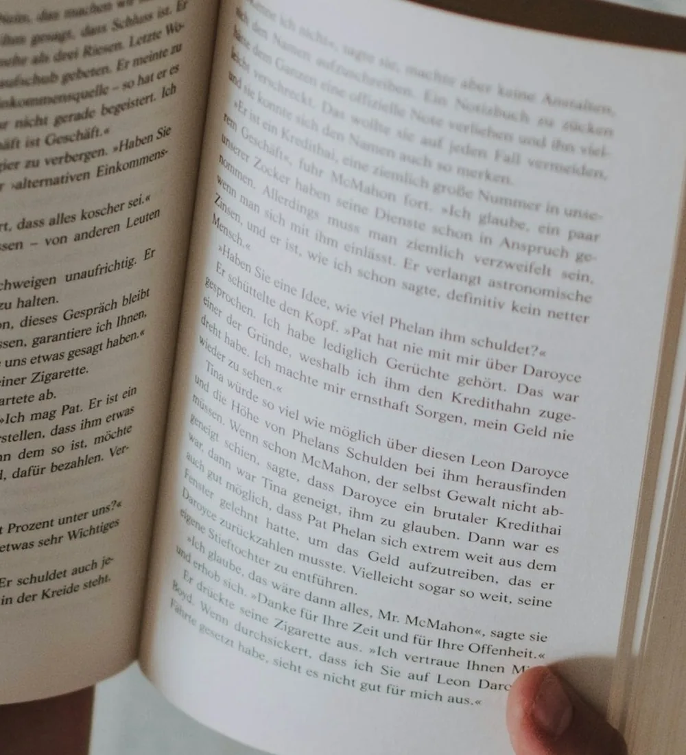 Before: Open book page whose lines of text bend where the paper curves towards the spine
