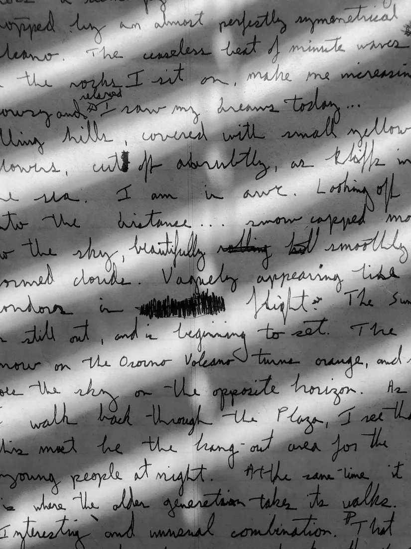Before: Handwritten page with hard diagonal shadows falling across it