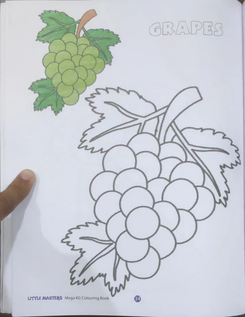 Before: Colouring page of grapes with a thumb holding the left edge of the page