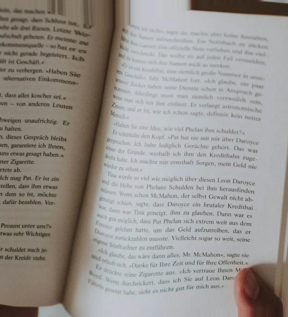 After: Open book page whose lines of text bend where the paper curves towards the spine